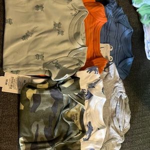 Six onesies made for a newborn boy